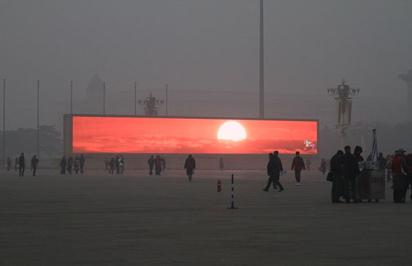 En Pekín se emite el amanecer en pantallas gigantes